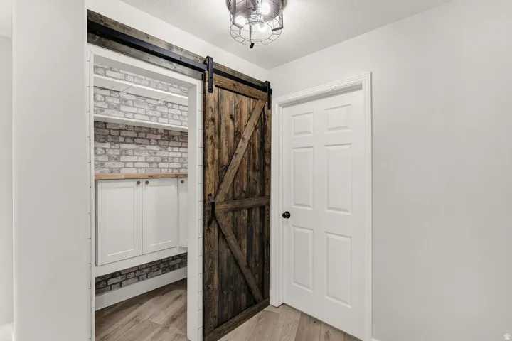 Kitchen Pantry with sliding barn door