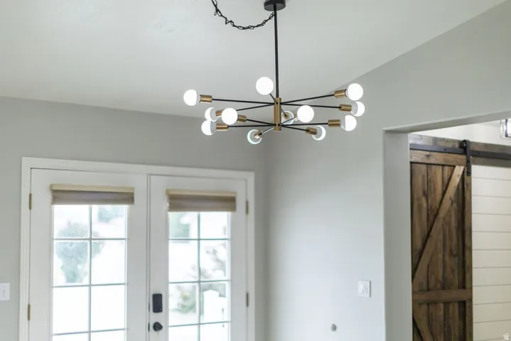 Sputnik-style chandelier with black and gold-tone accents
