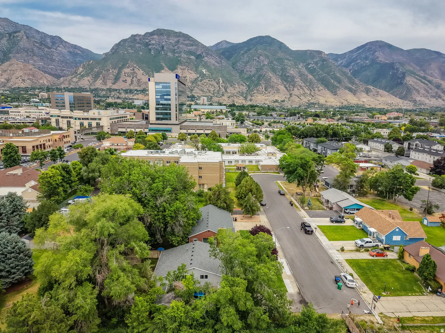 Expansive mountain backdrop with a diverse urban and residential landscape