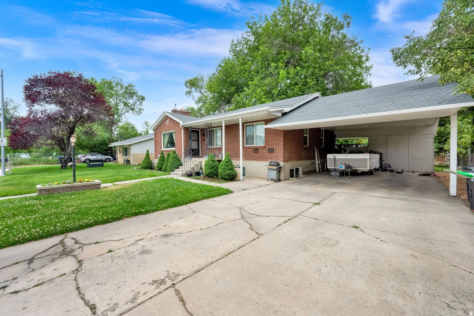 Brick exterior with a covered front porch featuring white railings