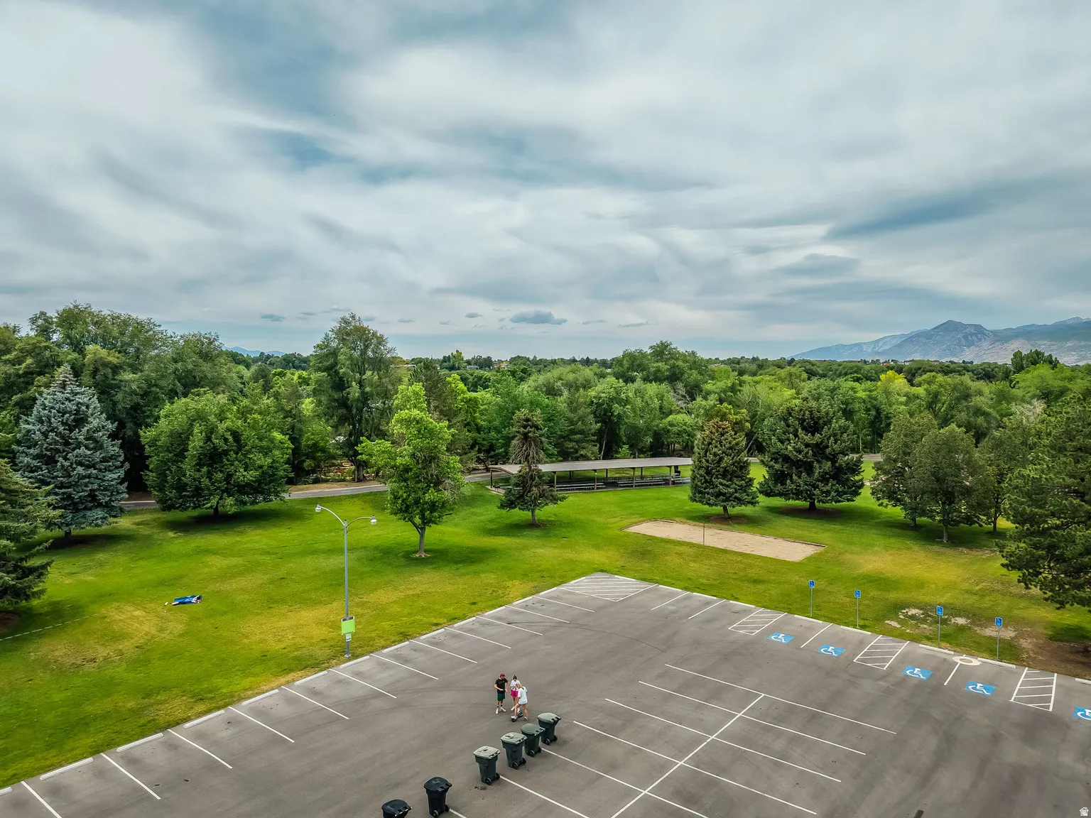 Expansive paved parking area with marked spaces and designated accessible parking