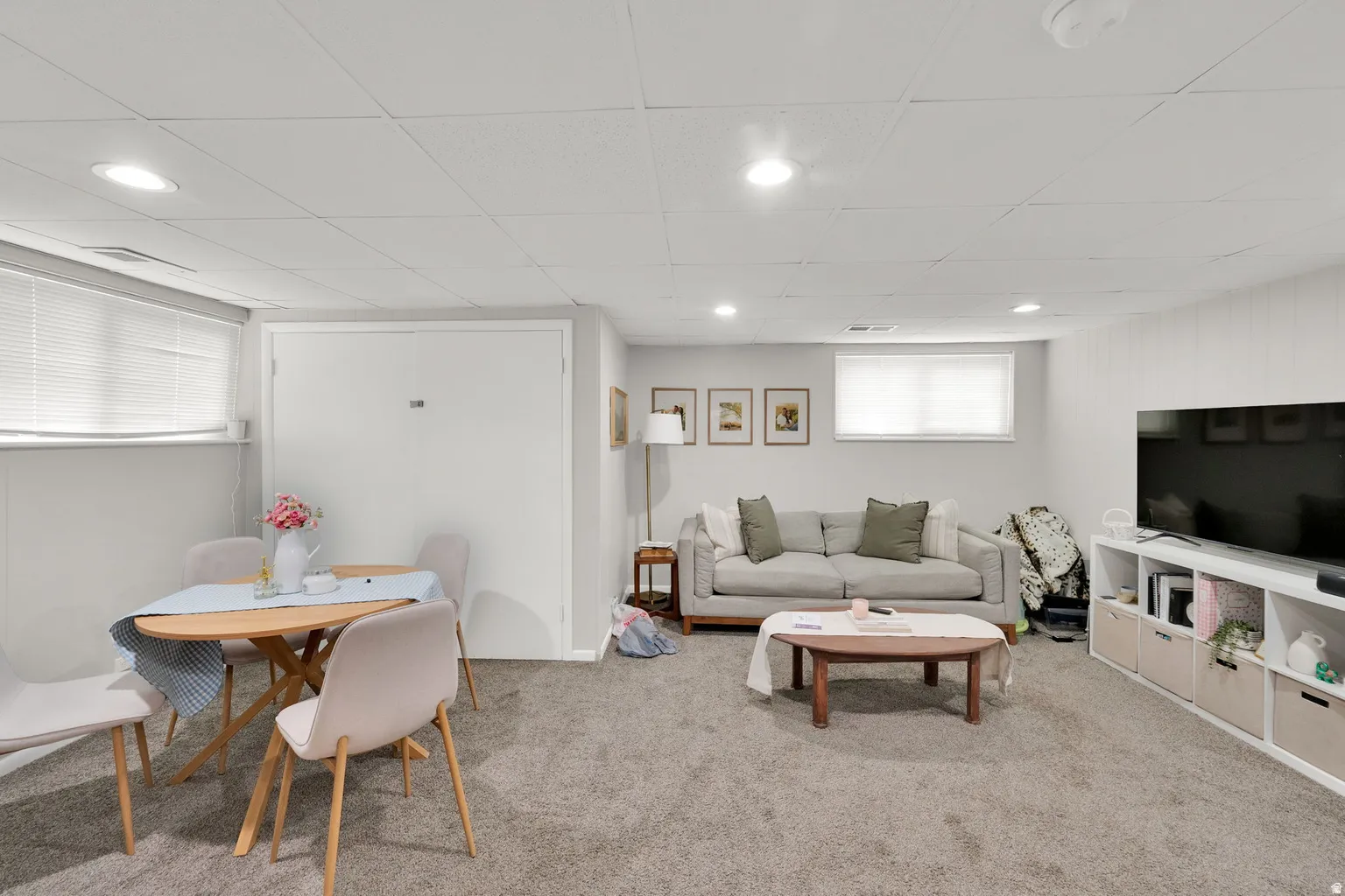 Finished lower-level space featuring recessed lighting and wall-to-wall carpeting