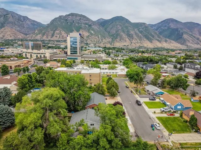 Expansive mountain backdrop with a diverse urban and residential landscape