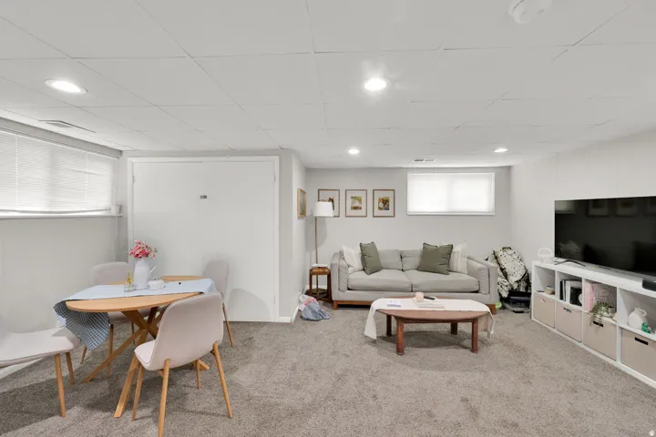 Finished lower-level space featuring recessed lighting and wall-to-wall carpeting