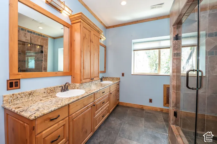 Level 2 Master Bathroom vanity featuring dual under-mount sinks set into a light-toned granite countertop