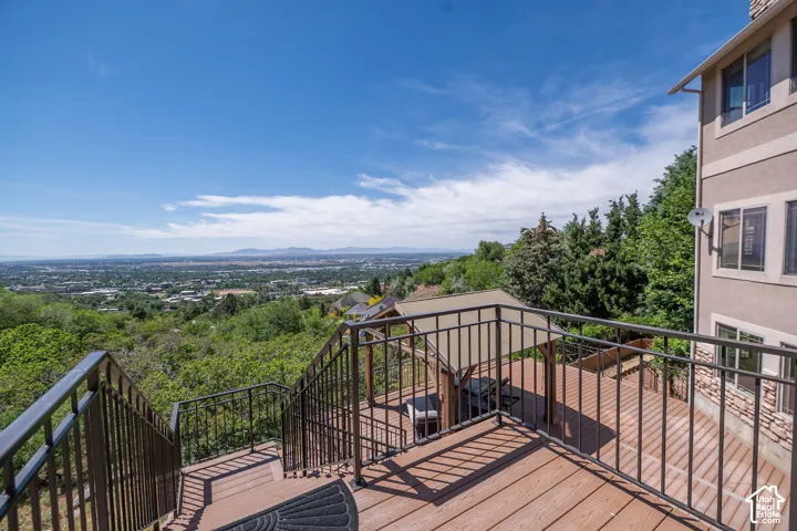 Second Level Master Bedroom patio walk out. Multi-level outdoor deck featuring wood-finish flooring and metal railings