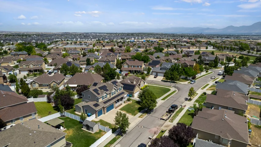 Aerial perspective of a residential neighborhood featuring detached homes with varied architectural styles
