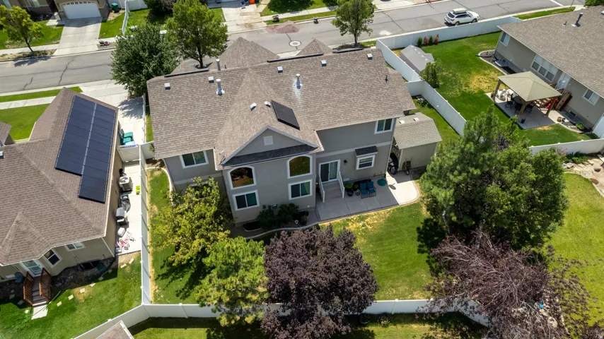 Spacious property featuring a large backyard with mature trees and a manicured lawn