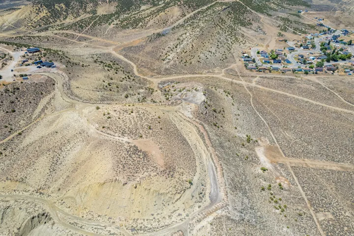 Expansive desert landscape featuring rolling hills and natural terrain