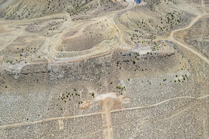 Expansive desert landscape featuring natural terrain and sparse vegetation