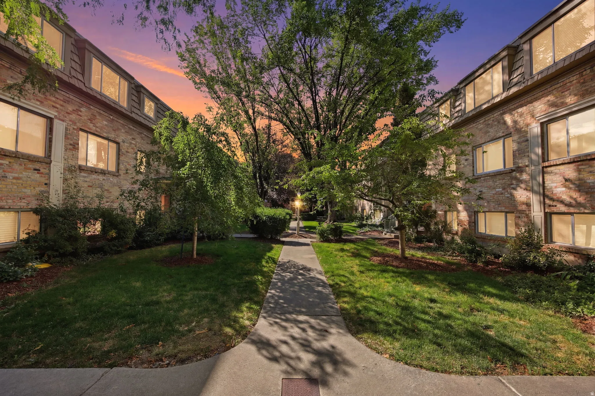 Brick facade apartment buildings framing a central walkway