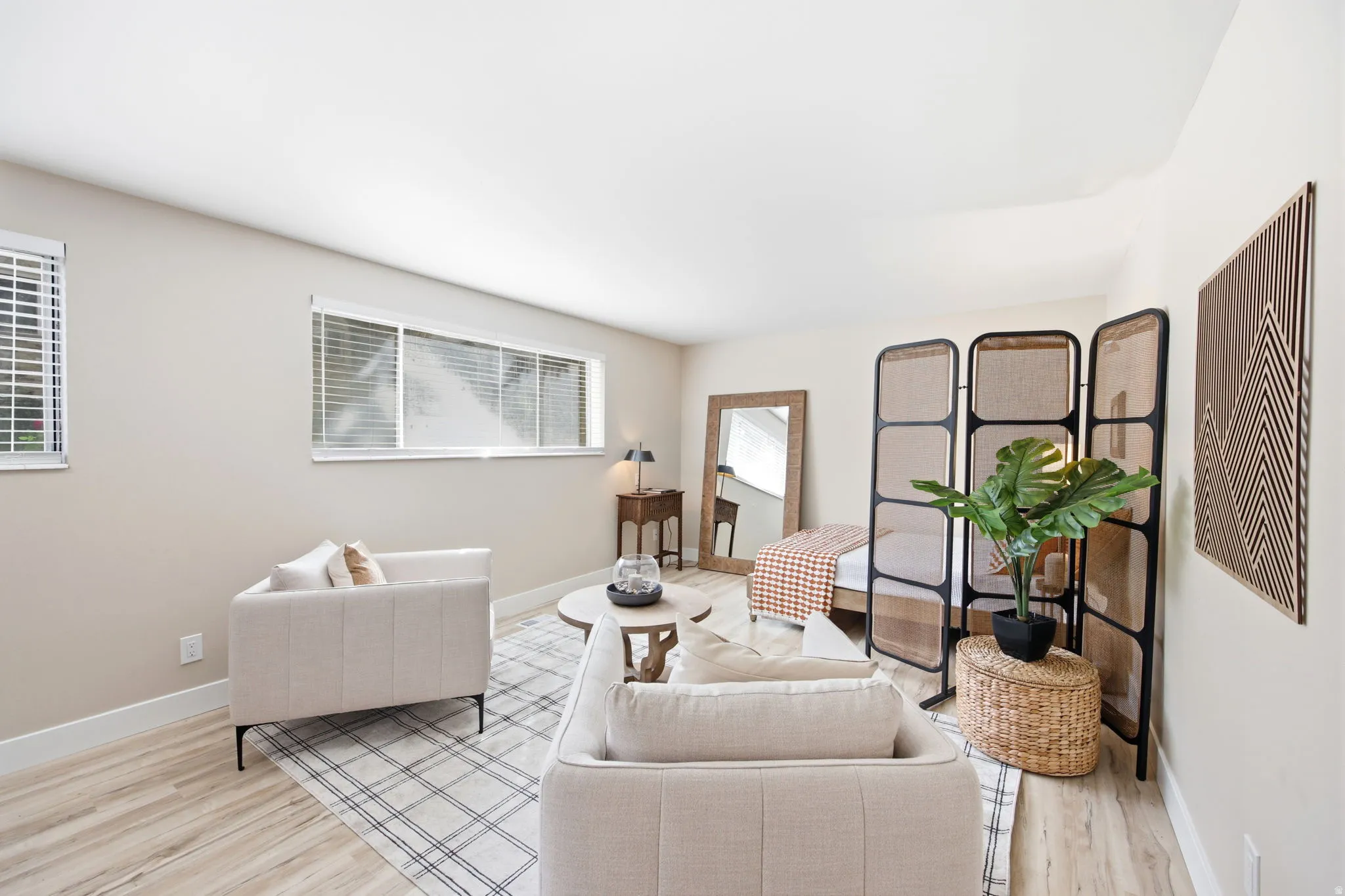 Spacious interior with neutral wall tones and light wood-finish flooring