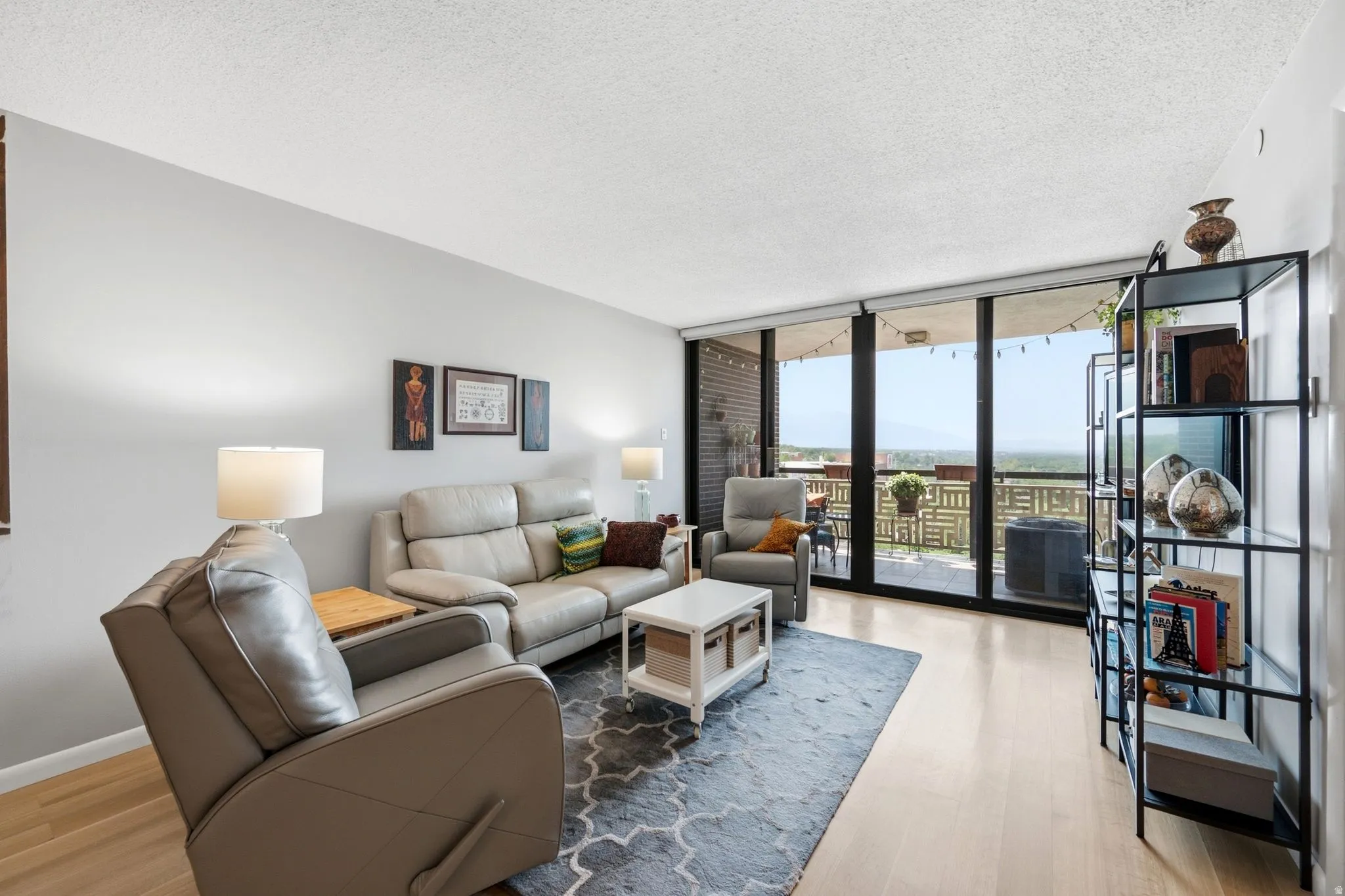 Living area with light wood-finish flooring and neutral wall tones