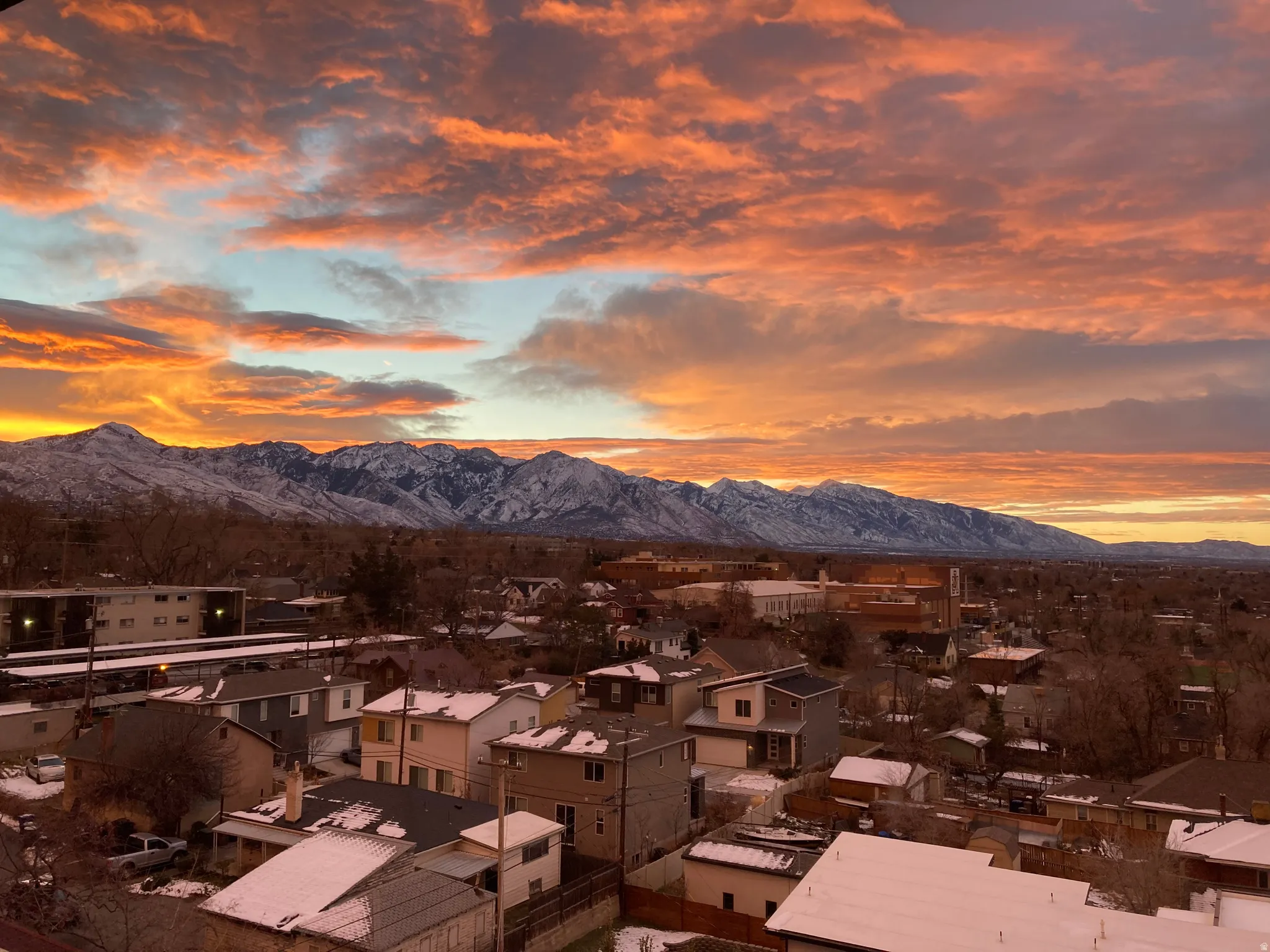 Mountain range backdrop with a vibrant, cloud-filled sky