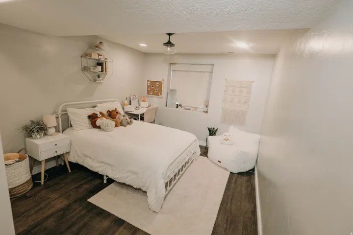 Bedroom featuring dark wood-finish flooring and light-toned walls