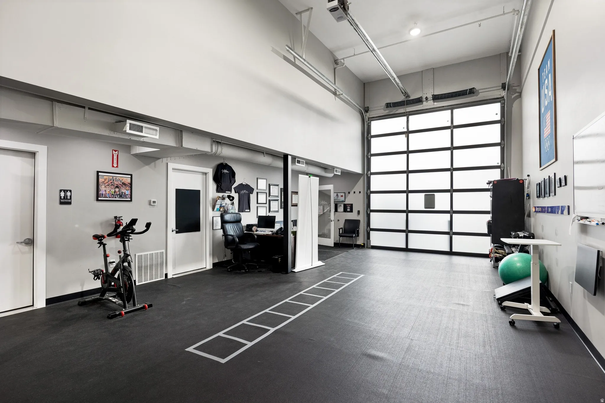 Spacious interior with high ceilings and rubber flooring