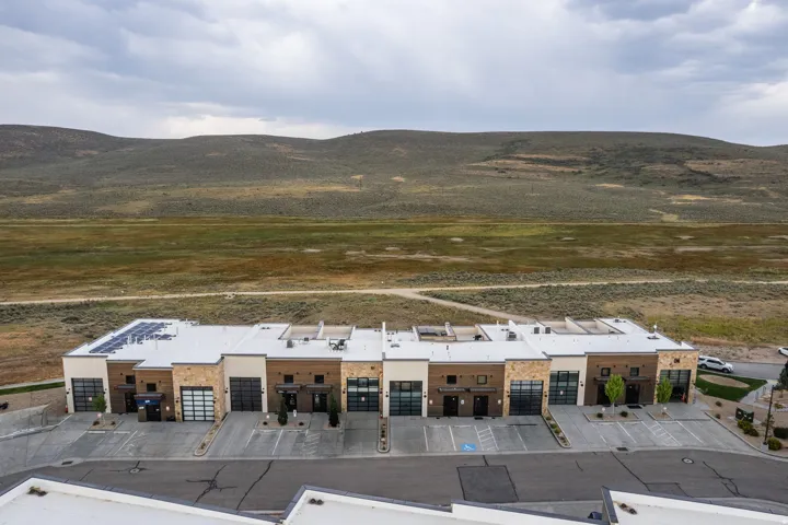 Contemporary townhome exteriors featuring varied stone and paneling finishes