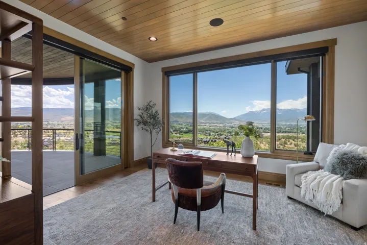Expansive window wall with mountain and valley scenery