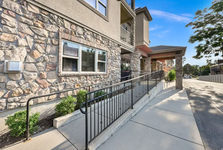 Ramp into Main Entrance: Stone veneer exterior with a covered entrance