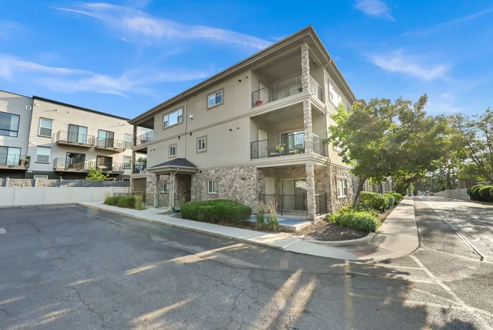 Corner Unit on 2nd floor: Multi-story residential building featuring stucco and stone veneer siding