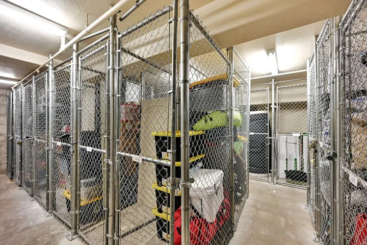 Storage on Level G: 10 Level (Ground) Secure individual storage units featuring chain-link construction and concrete flooring