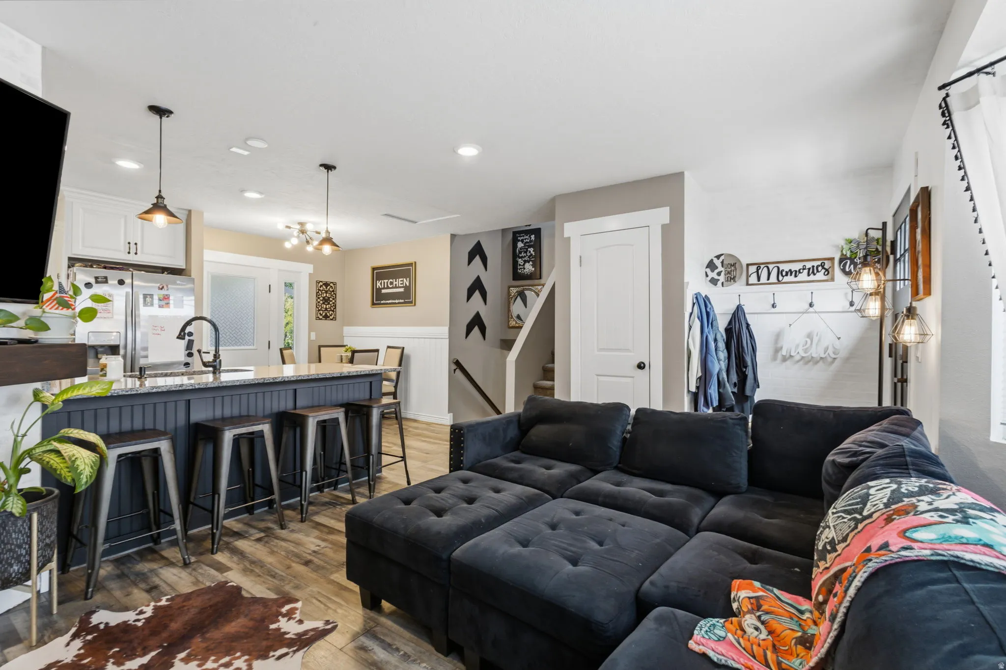 Open-concept living space with wood-finish flooring