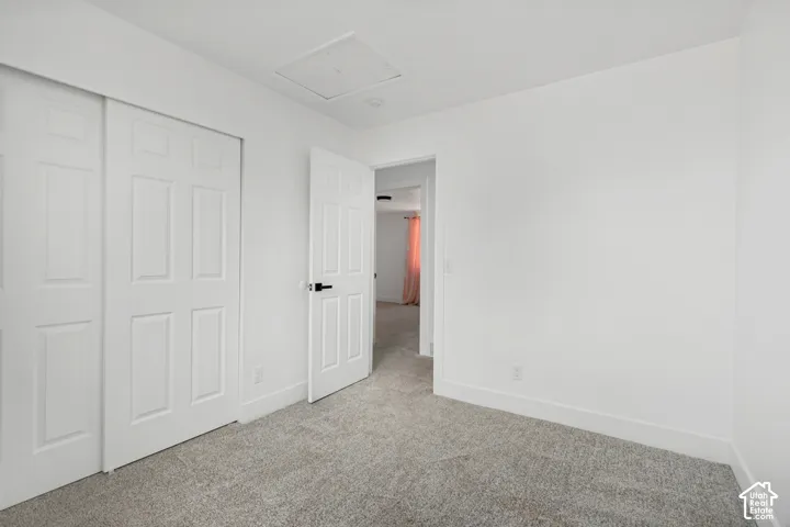 Neutral-toned carpeting paired with white walls
