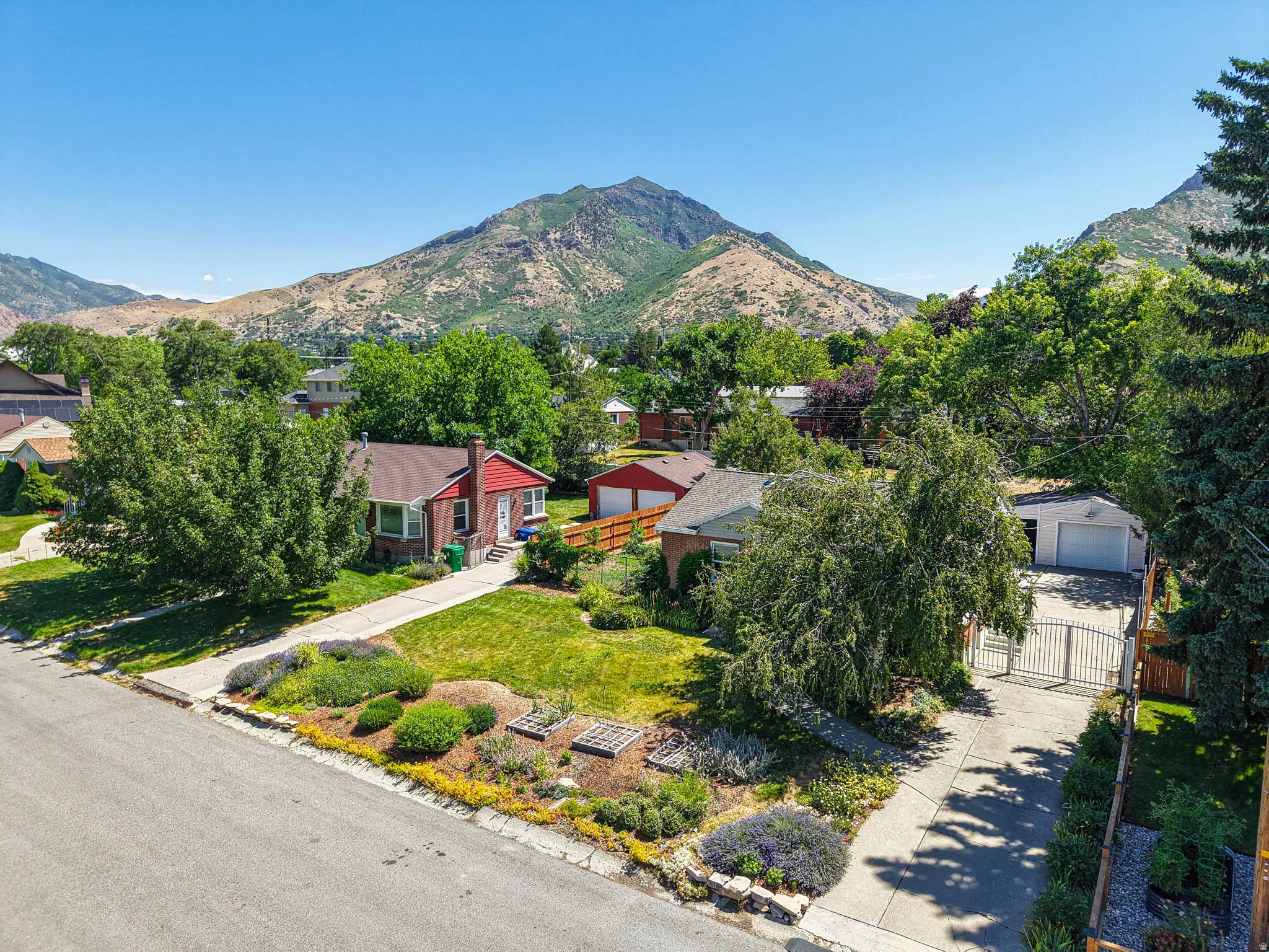 Aerial perspective showcasing the residential property with mountain backdrop