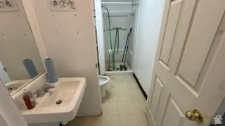 Pedestal sink with chrome faucet and mirror