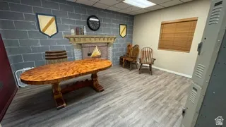 Interior space featuring an accent wall with faux stone finish and a decorative fireplace
