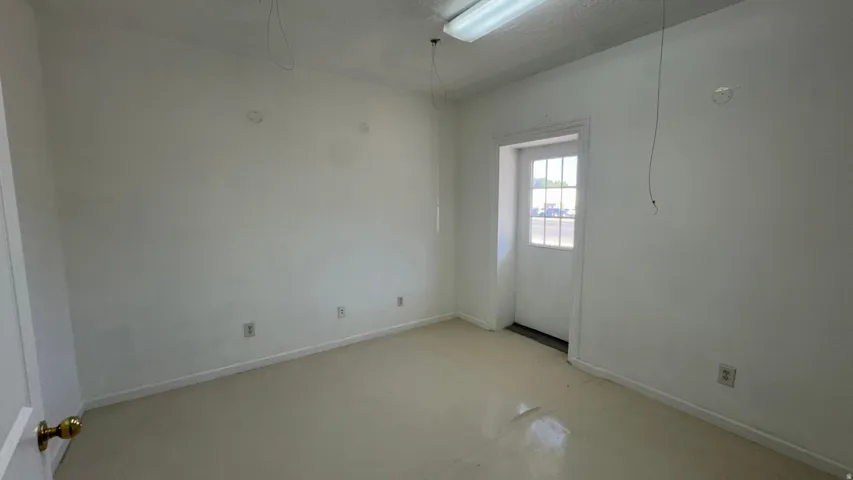 Room featuring light-colored flooring and white walls