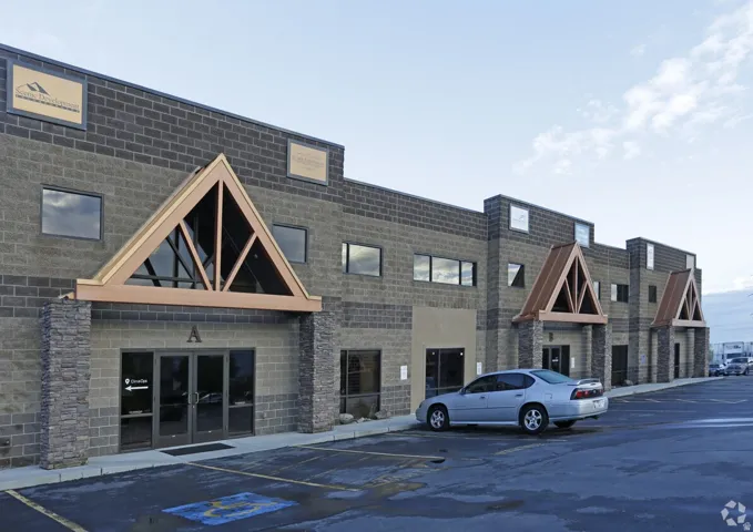 Commercial building facade featuring multi-tone block construction and stone accents