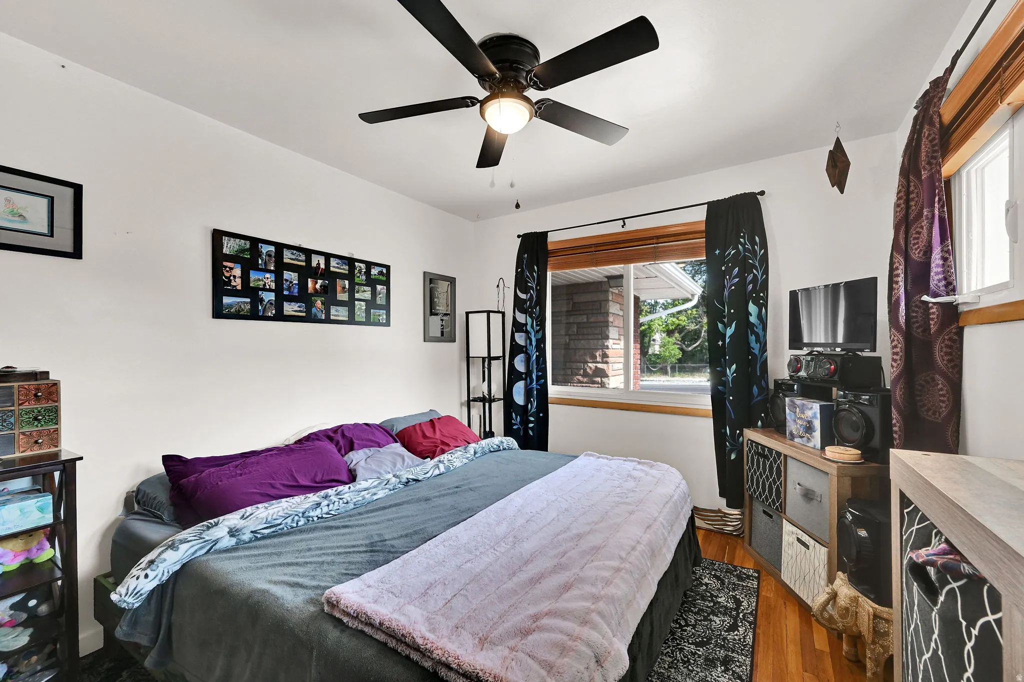 Hardwood flooring complemented by a ceiling fan with integrated lighting