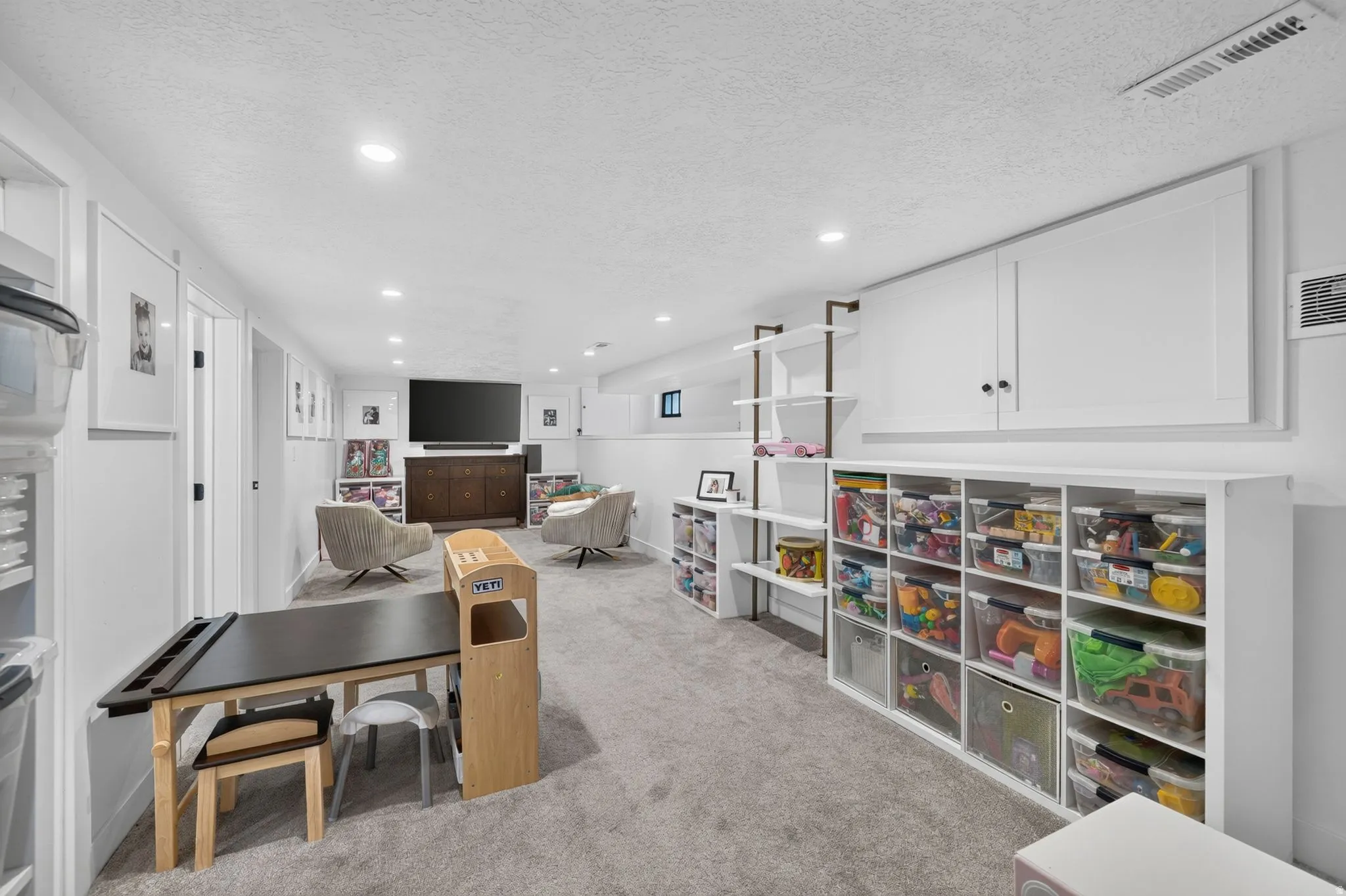 Versatile & large basement family room.  Recessed lighting, and extra storage space.