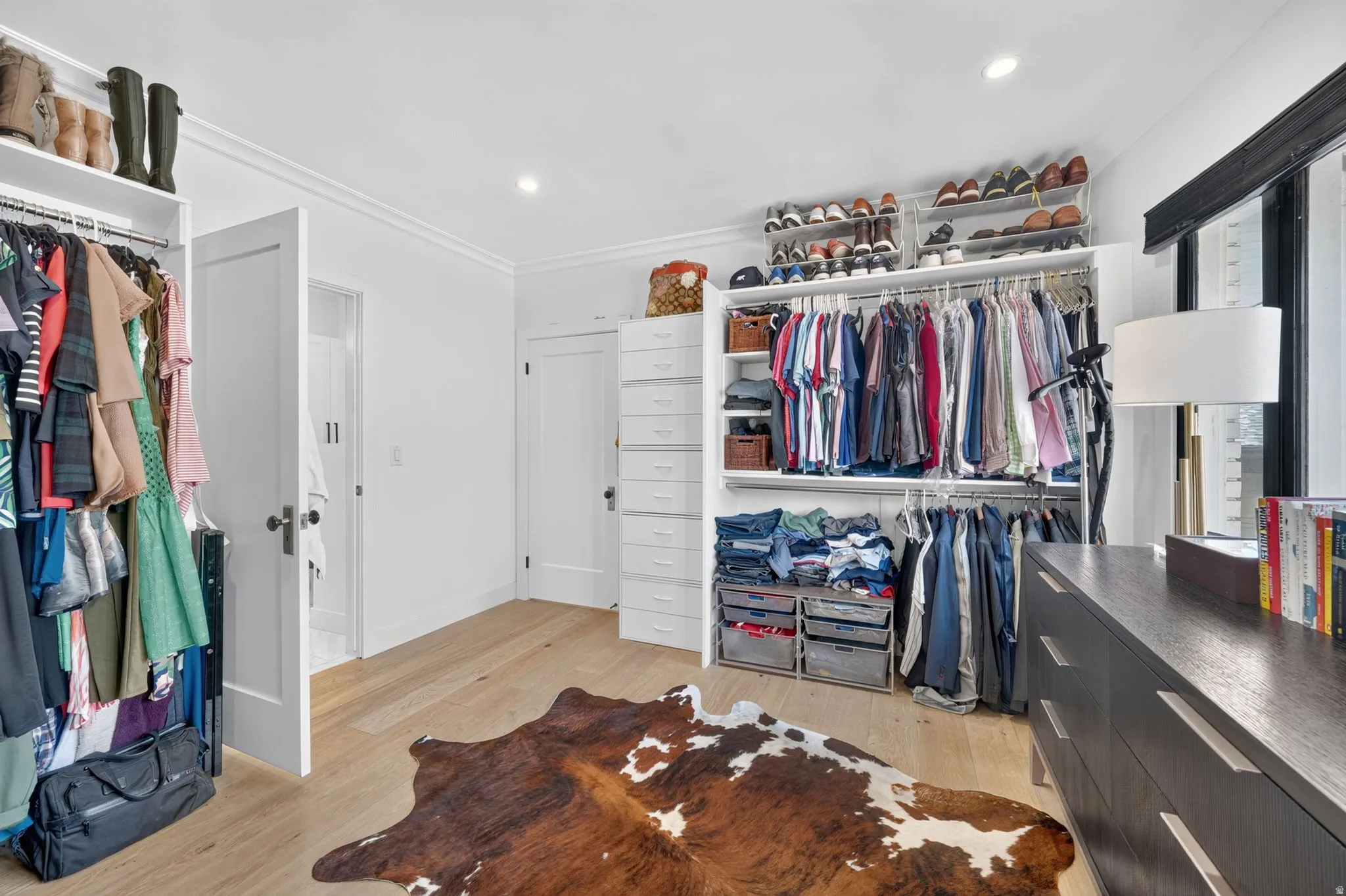 Expansive custom walk-in closet.  Natural light pouring in, dual-direction custom window coverings, AND hook ups in closet for stackable washer & dryer.