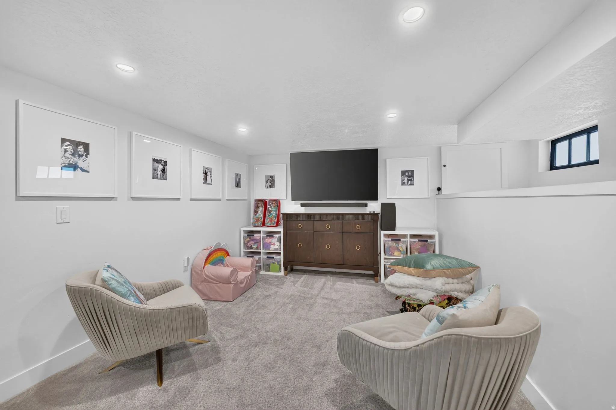 Cozy family room with extra storage space in shelf part of wall.
