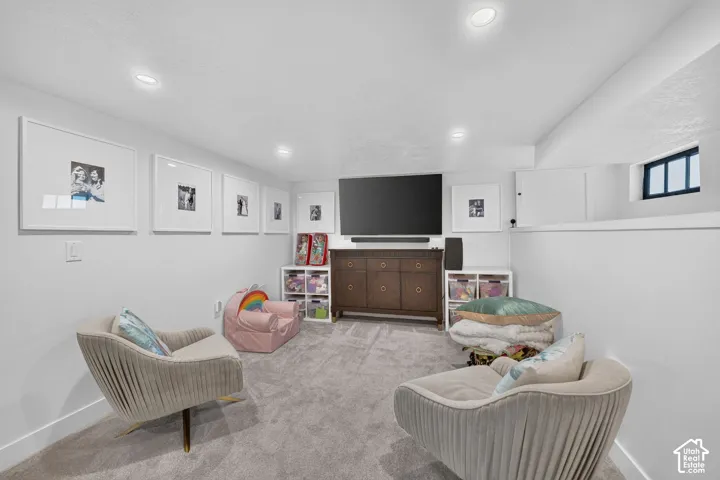 Cozy family room with extra storage space in shelf part of wall.