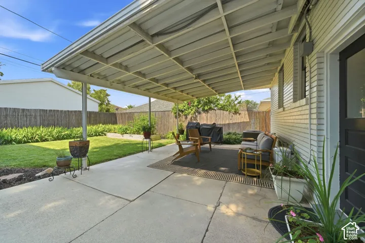 Covered patio off back door.  Well maintain back yard, full sprinkler & drip system, raised garden boxes,  and manicured flower beds.