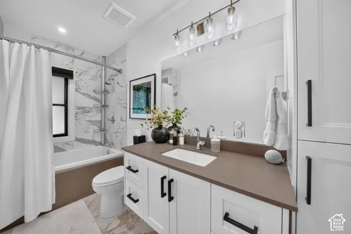 2nd bathroom on main floor.  Large, deep tub/shower with tile walls and shelves.  Quartz countertops, custom linen closet.