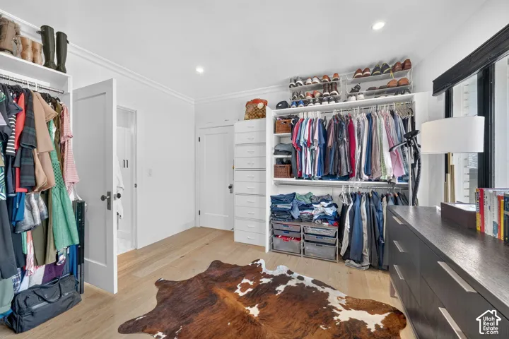 Expansive custom walk-in closet.  Natural light pouring in, dual-direction custom window coverings, AND hook ups in closet for stackable washer & dryer.
