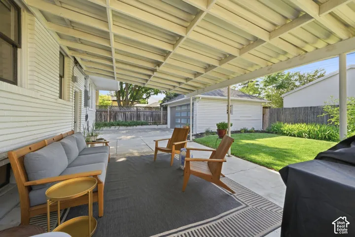 Covered patio, well manicured back yard, 2 car garage, and EV car charger.