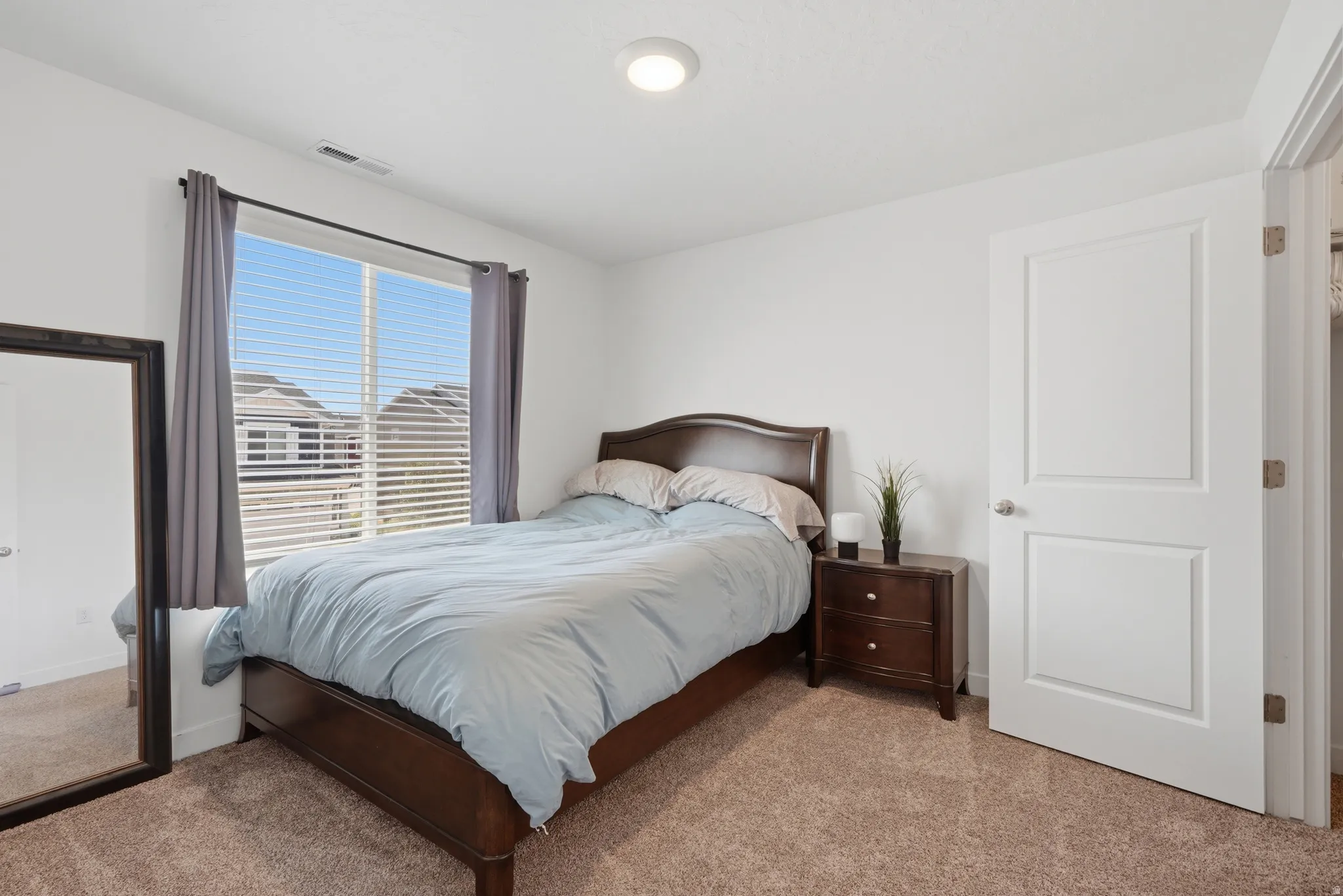 Room featuring carpet flooring and white walls
