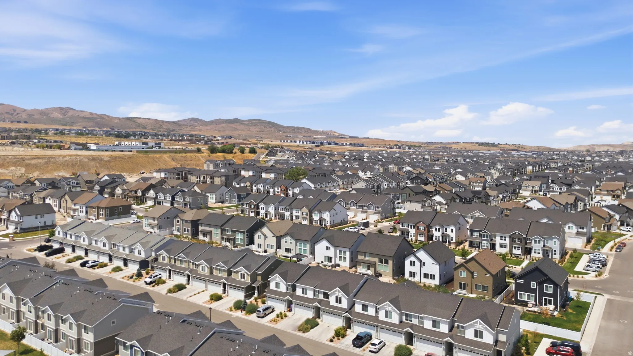 Expansive community showcasing a variety of contemporary residential structures