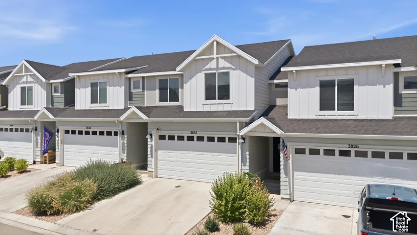 Modern townhome exteriors featuring vertical and horizontal siding