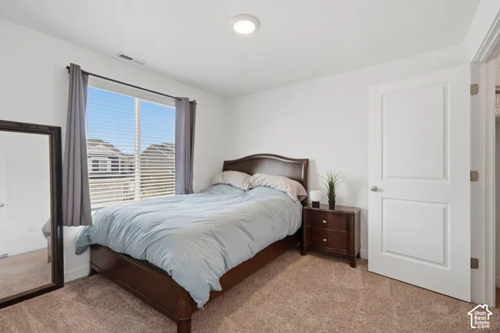 Room featuring carpet flooring and white walls