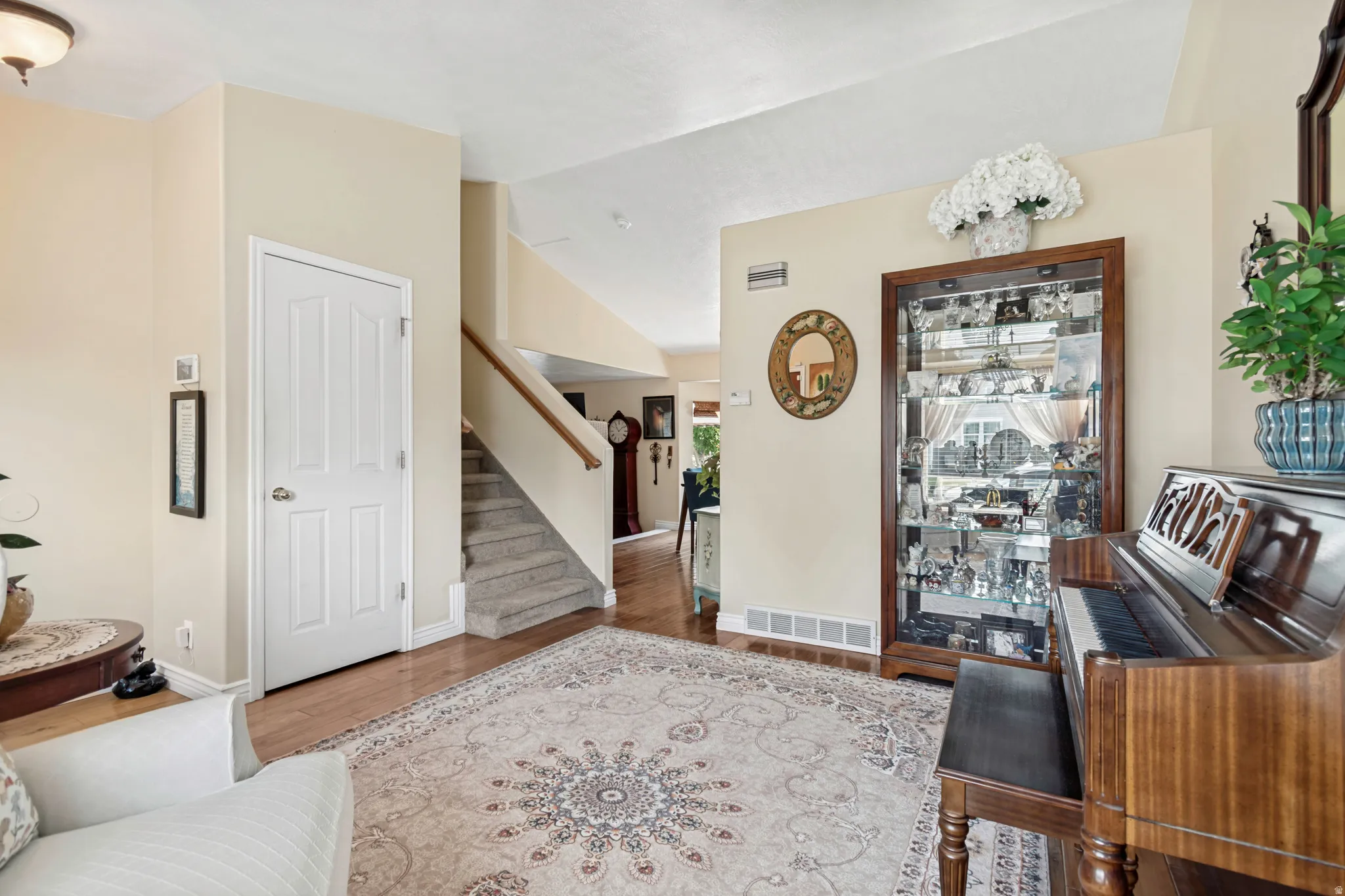 Neutral tone walls complementing wood-finish flooring
