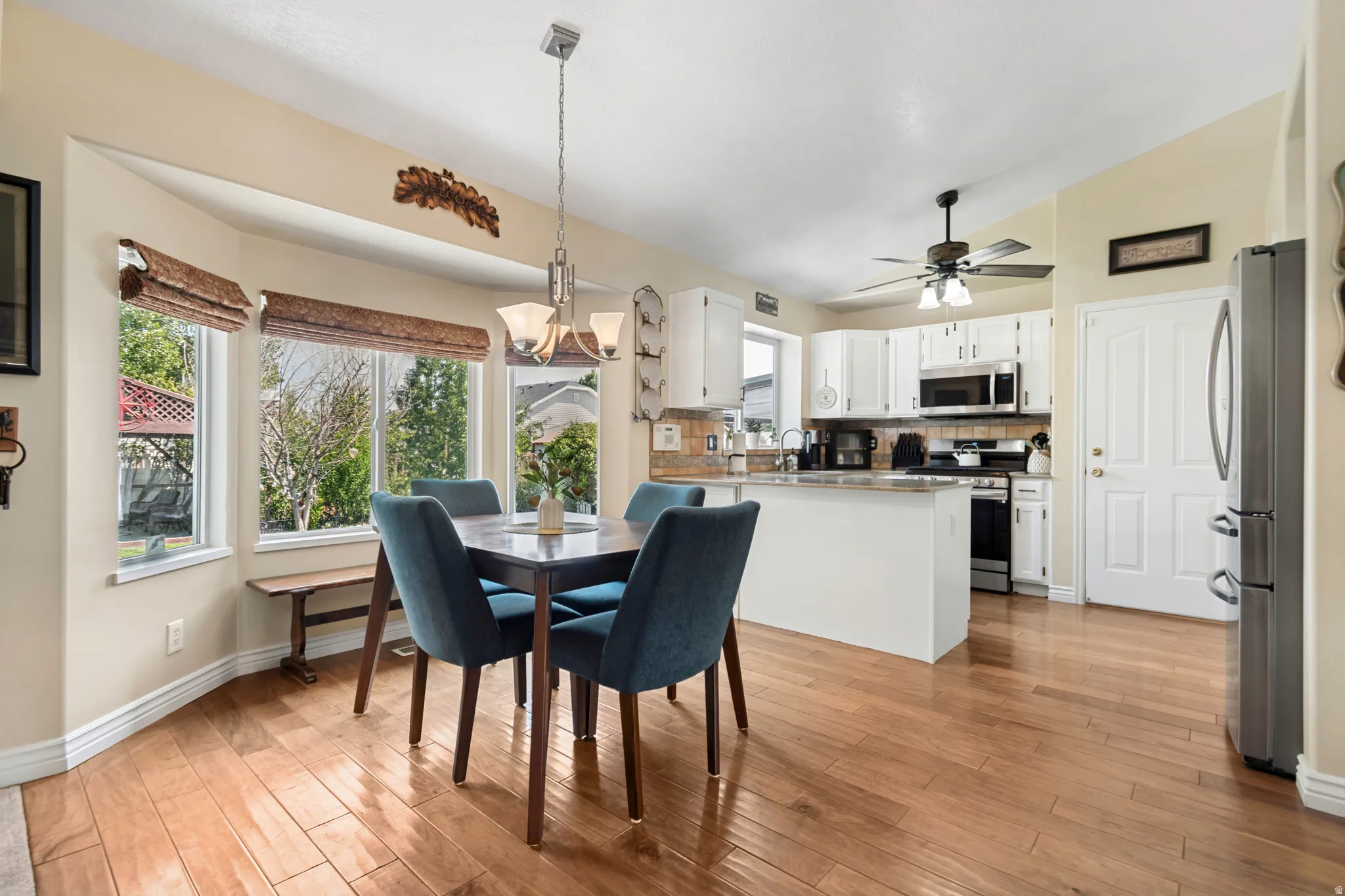 Open-concept living space featuring wood-finish flooring throughout