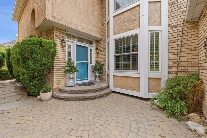 Brick and stucco exterior with an arched entryway