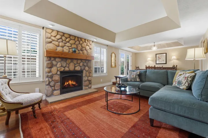Stone-front fireplace with a substantial wood mantel