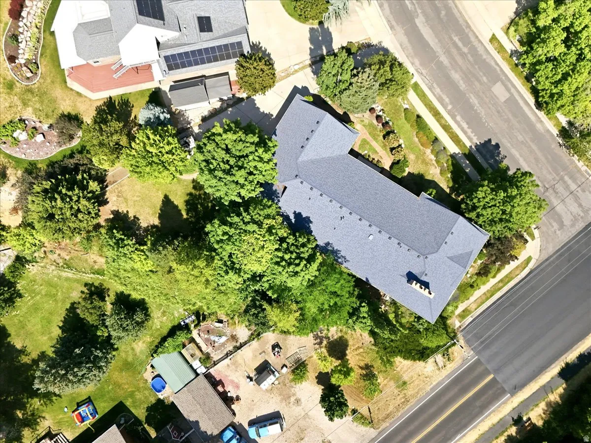 Extensive property featuring a multi-gabled roofline and surrounding mature trees